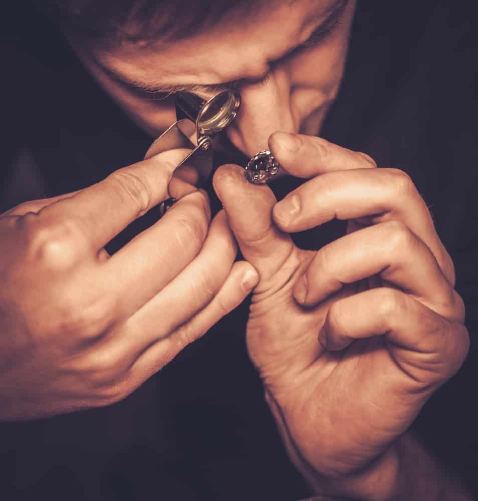 Portrait of a jeweler during the evaluation of jewels.